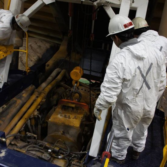 Workers looking reviewing machinery using Trilift parts