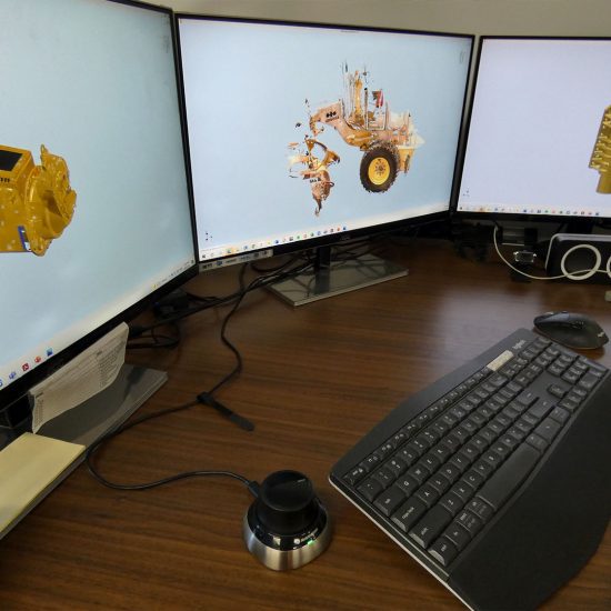 a three monitor computer setup being used for 3d modeling