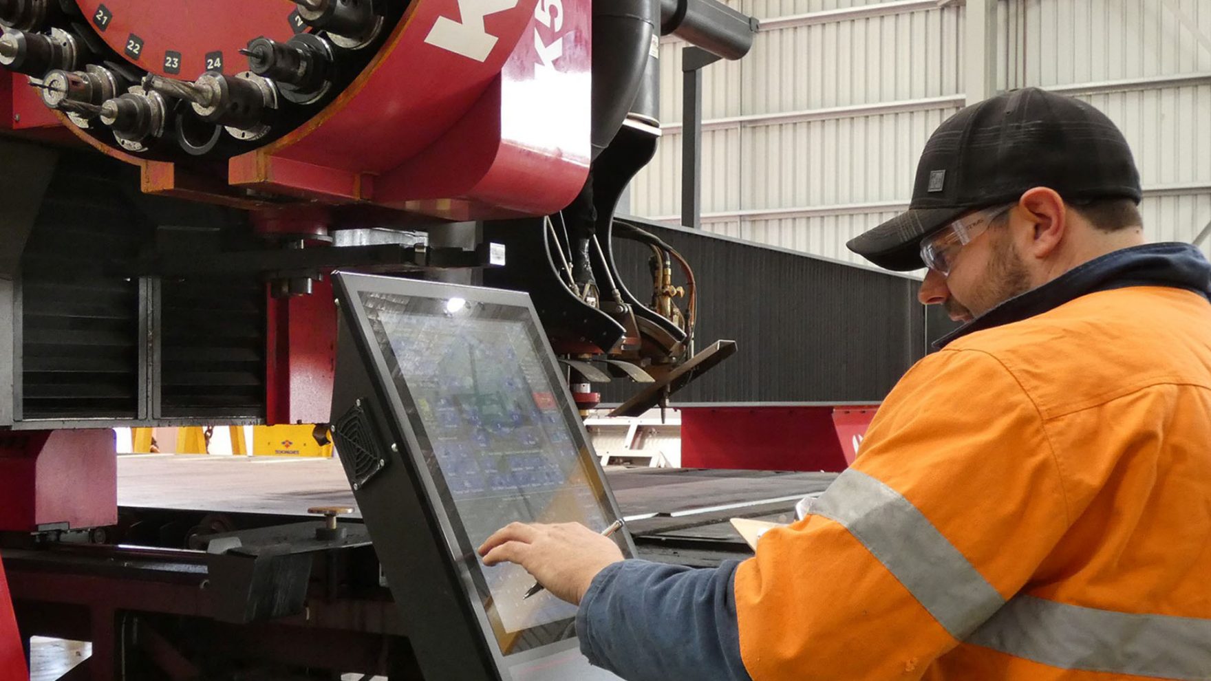 Hedweld engineer operating a CNC machine
